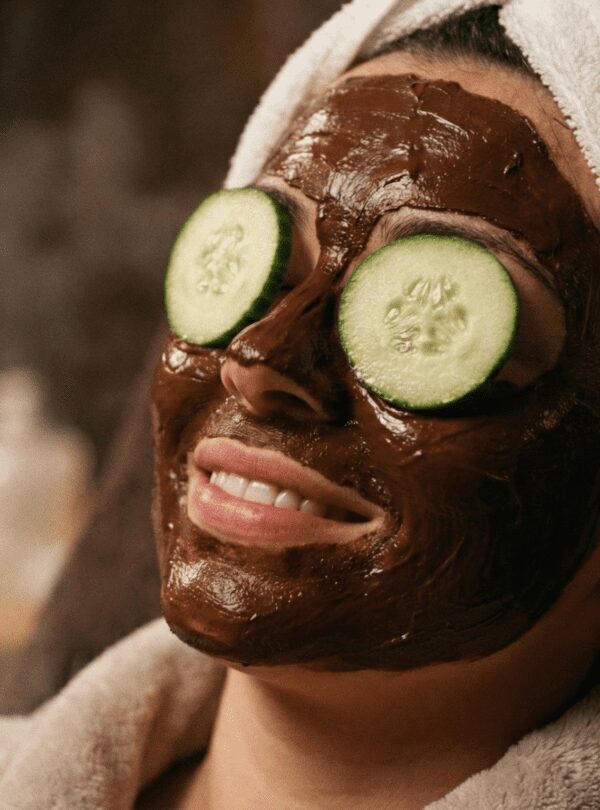 Woman enjoying a chocolate face mask during the Cleopatra Plus Spa Ritual