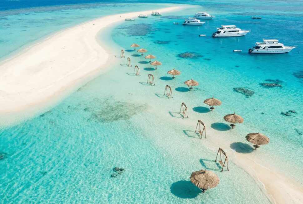 Aerial view of Orange Bay Island in Hurghada featuring white sands and turquoise waters, known as the Egyptian Caribbean.