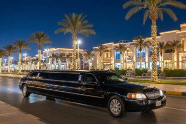 Professional black limousine waiting on El Mamsha promenade Hurghada at night for safe tourist transport.