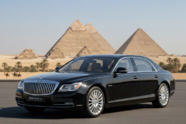 Luxury car parked with a view of Giza Pyramids for Hurghada to Pyramids private trip.